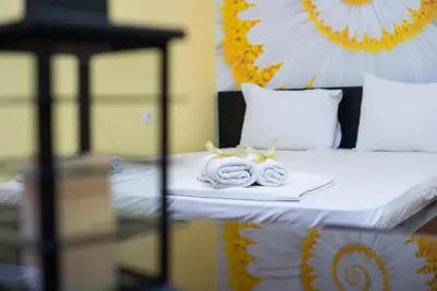 a bed with a tray of towels on it at Apartment Kalemegdan in Belgrade