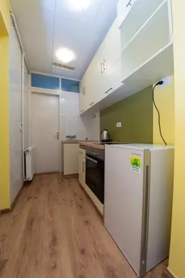a kitchen with a white refrigerator and a sink at Apartment Kalemegdan in Belgrade