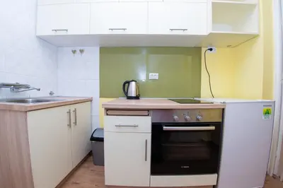 a small kitchen with a sink and a stove at Apartment Kalemegdan in Belgrade