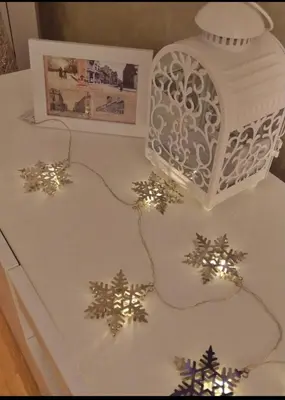 a white cake with christmas decorations on a table at Marco’s home in Vračar (historical)