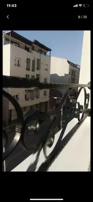 a close up of a pair of scissors in front of a building at Marco’s home in Vračar (historical)