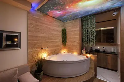a bath tub in a bathroom with a star ceiling at Central SPA Galaxy Apartment in Belgrade