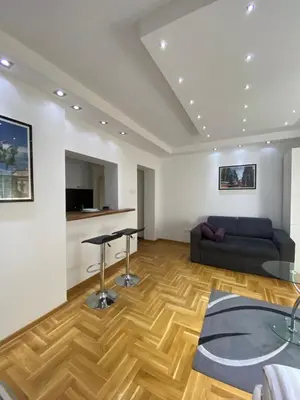 a living room with a couch and a table at Cika Ljuba in Belgrade