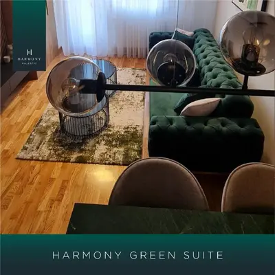 a living room with green furniture and a green couch at Harmony Apartmani Arandjelovac in Arandjelovac
