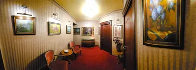 a hallway with a room with a red carpet at Vila Geppetto in Belgrade