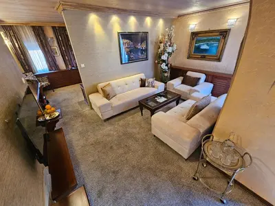 an overhead view of a living room with couches at Vila Geppetto in Belgrade