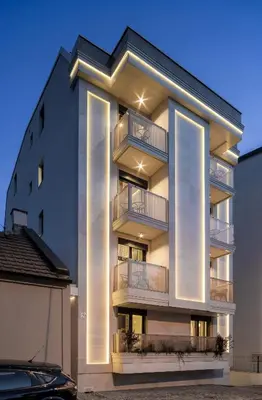 a building with balconies on the side of it at Belly3 in Belgrade