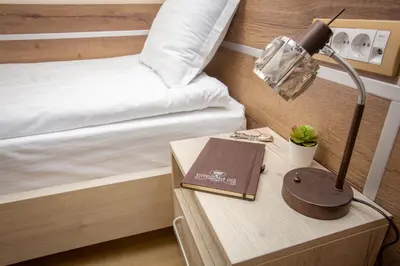 a bedroom with a bed and a lamp on a table at HARIZMA 013 in Kovin