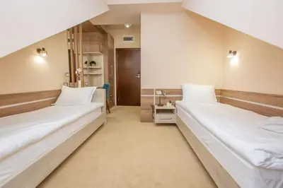 a room with two beds in a room at HARIZMA 013 in Kovin