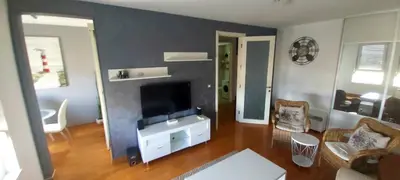 a living room with a flat screen tv and a couch at Apartman Tea Belville in Belgrade