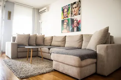 a living room with a couch and a table at Apartman Tea Belville in Belgrade