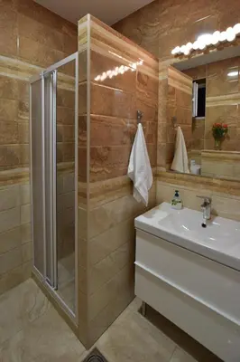 a bathroom with a shower and a sink at Crown apartment - Your most comfortable stay in Belgrade