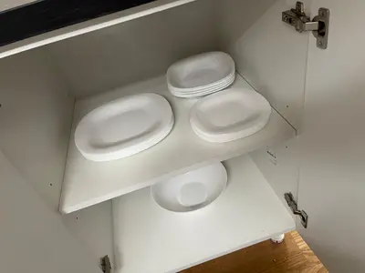 a bathroom with two white urinals on a shelf at Royal Residence Apartmani 2 in Pančevo