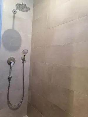 a shower with a shower head in a bathroom at Beograd centar in Belgrade