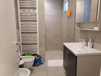 a bathroom with a white sink and a toilet at Beograd centar in Belgrade