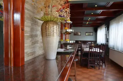 a large vase sitting on a counter in a restaurant at Hotel Topcider in Belgrade