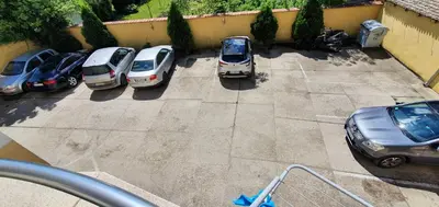 a bunch of cars parked in a parking lot at Julija 2 in Pančevo