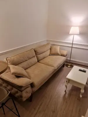 a living room with a couch and a table at Apartment Nusic residence in Belgrade