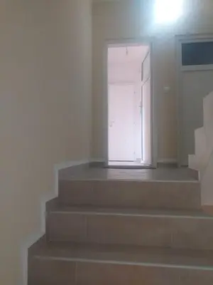 a stairway with a door and a window at Alex-Branka apartments in Zemun