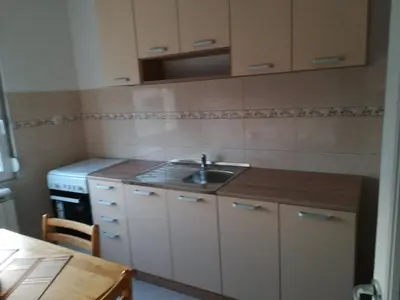 a small kitchen with a sink and a stove at Alex-Branka apartments in Zemun