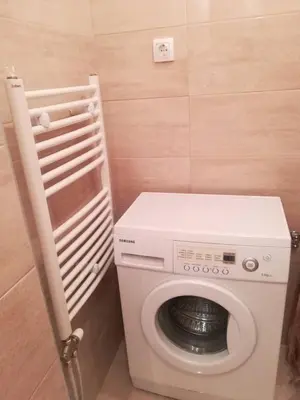 a washer and dryer in a small bathroom at Alex-Branka apartments in Zemun