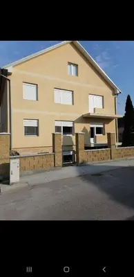 a large building on the side of a street at Alex-Branka apartments in Zemun