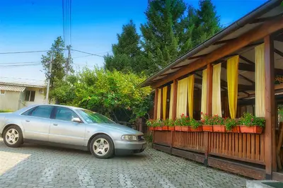 a car parked in front of a house at Vila Chess in Belgrade