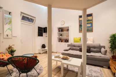 a living room with a couch and a table at KARIOKA apartman in Belgrade