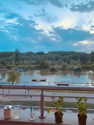 a view of a large river from a balcony at Apartman ANN in Pančevo