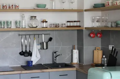 a kitchen with a sink and a counter with utensils at Wellport30 in Belgrade
