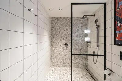 a shower with a glass door in a bathroom at Hotel Indigo Belgrade by IHG in Belgrade