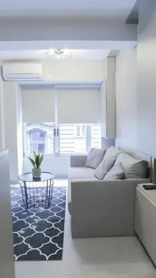 a living room with a couch and a table at Apartments Srbija Waterfront - FREE PARKING in Belgrade