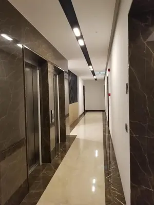 a hallway of an office building with elevators at Azura Residence - new luxury apartment in Belgrade