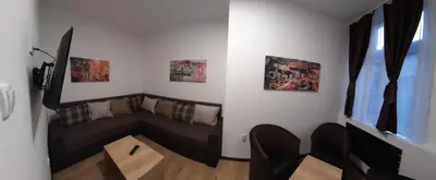 a living room with a couch and two chairs at BUDGET Apartment Artistika, 3 Bedrooms and 2 full Bathrooms in Belgrade
