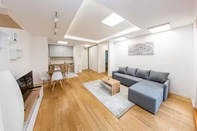 a living room with a couch and a table at Apartment N2 - A Blok in Belgrade
