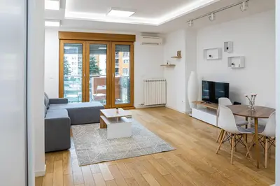 a living room with a couch and a table at Apartment N2 - A Blok in Belgrade