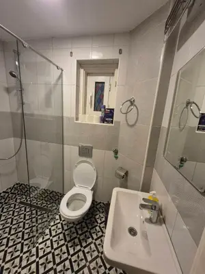 a bathroom with a toilet and a sink at BUDGET Guest Room in Central Pedestrian Zone in Belgrade