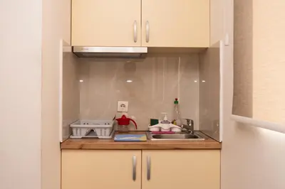a kitchen with a sink and a counter top at apartman Fuerte 2 in Belgrade