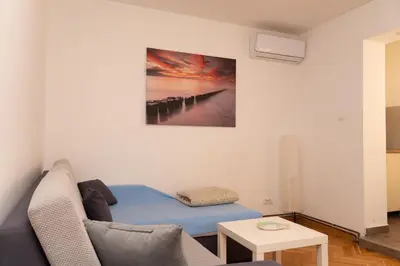 a living room with a couch and a table at apartman Fuerte 2 in Belgrade