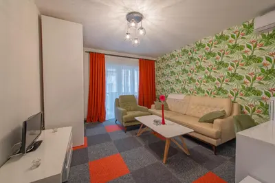 a living room with a couch and a table at Apartmani Maximilian in Čukarica