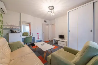 a living room with a couch and a table at Apartmani Maximilian in Čukarica