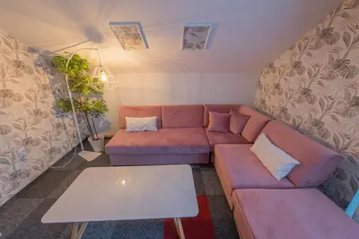 a living room with a couch and a table at Apartmani Maximilian in Čukarica