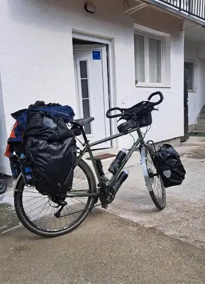 a bike is parked in front of a house at Dvoriste Danguba in Nova Pazova
