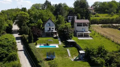 an aerial view of a house with a swimming pool at Family House in Krčedin
