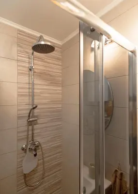 a shower with a glass door in a bathroom at Diva apartman in Arandjelovac