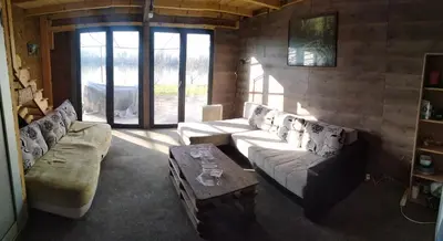 a living room with a couch and a coffee table at Top Chill party kucice apartmani in Belgrade