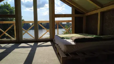 a room with a bed in a room with a window at Top Chill party kucice apartmani in Belgrade