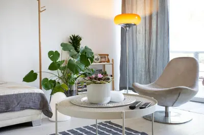a living room with a coffee table and a chair at River house Grana in Belgrade