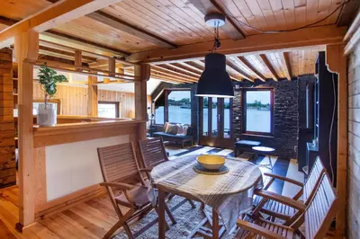 a dining room with a table and chairs at River house Vasa in Belgrade