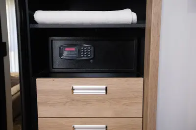 a drawer with a microwave in a cabinet at Hotel Borneo in Pančevo